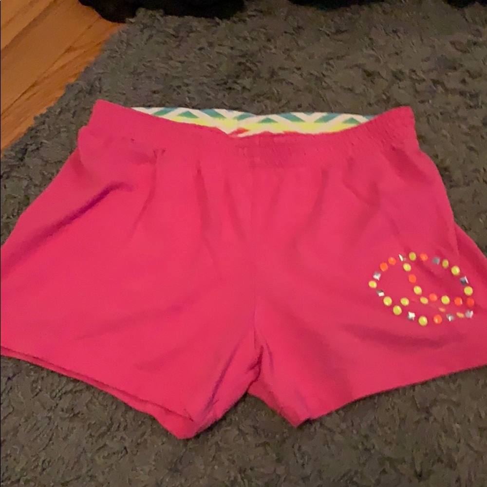 Pink shorts with a peace sign from faded glory
